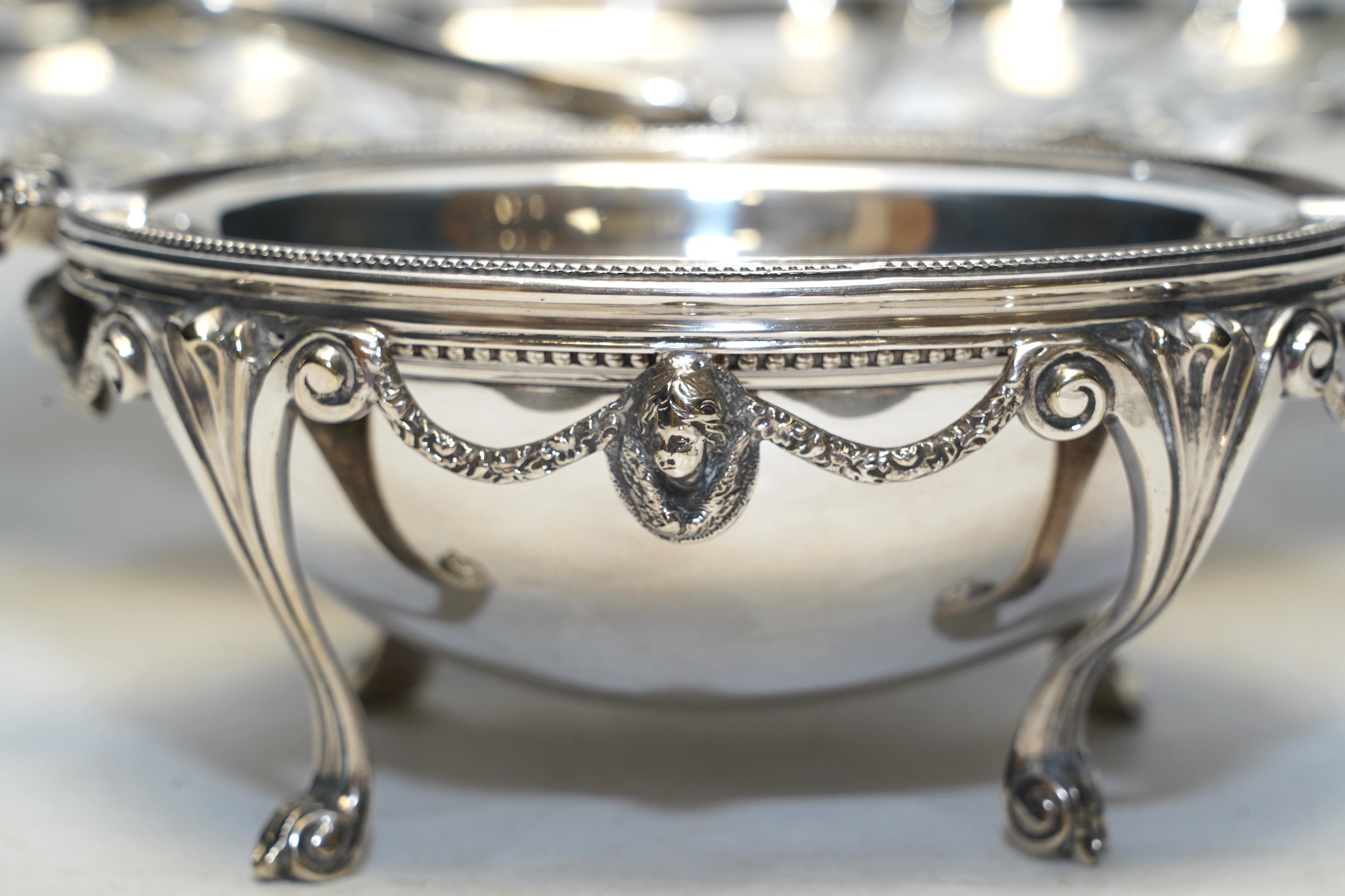 A silver plated breakfast butter dish, an EPNS basket and a pair of salad servers. Condition - good